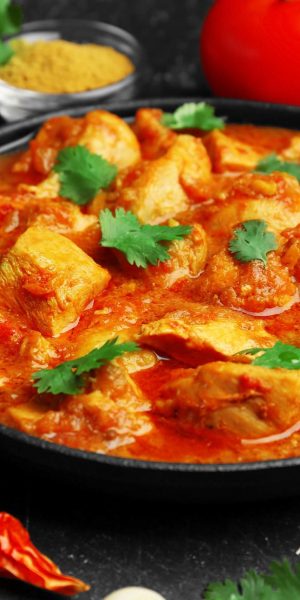 Chicken curry with different spices, closeup Chicken curry with different spices, closeup