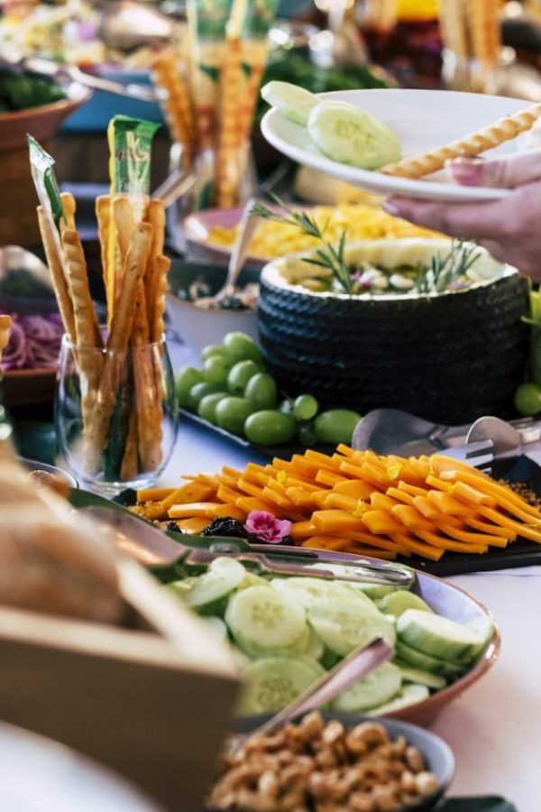 close-up-of-people-taking-food-from-table-at-event-party-with-catering-self-service.jpg